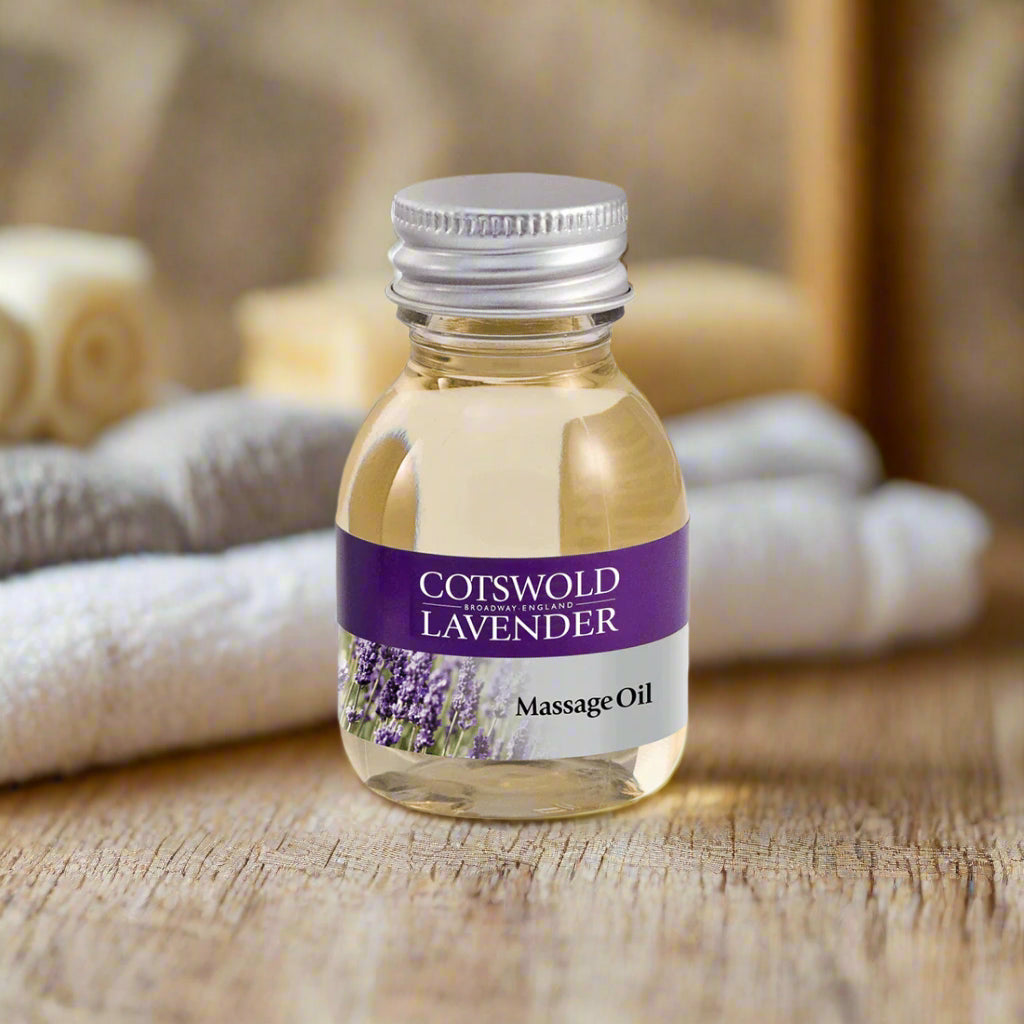 Bottle of Cotswold Lavender massage oil on a white background