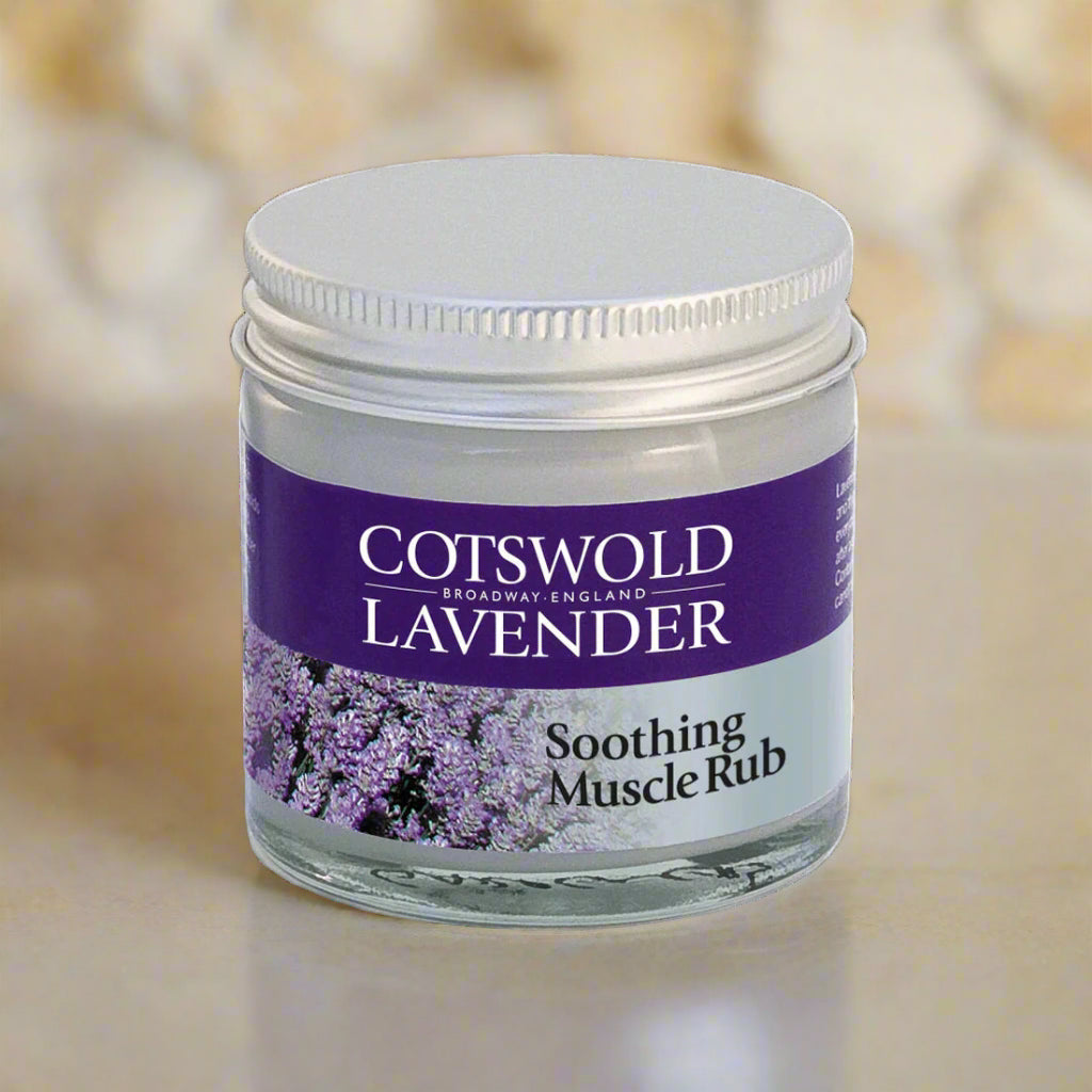 Jar of Cotswold Lavender soothing muscle rub on a blurred background
