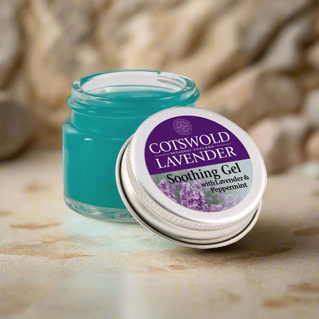 Cotswold Lavender soothing gel jar with purple label on a stone surface