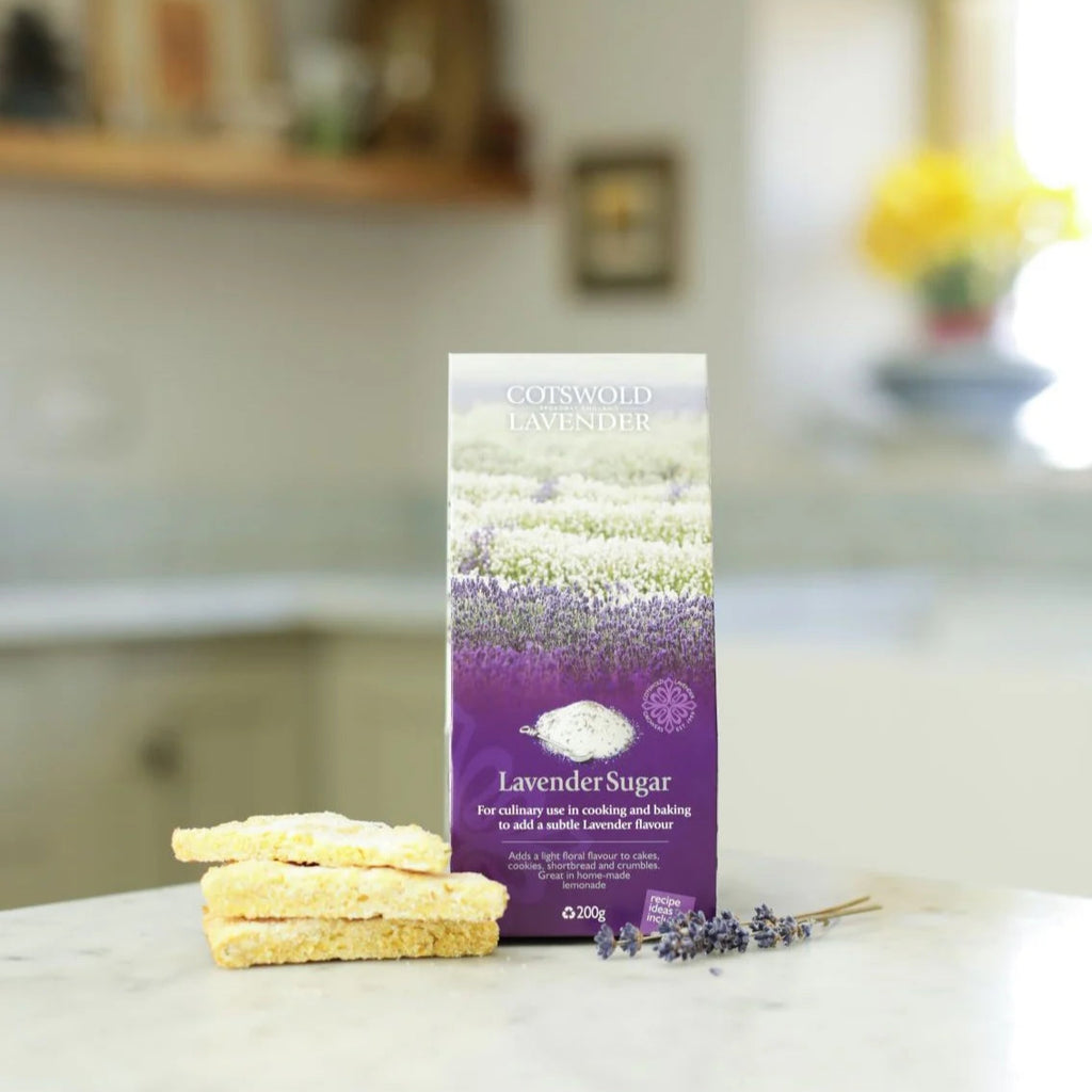 Gotskold Lavender lavender sugar package on a kitchen counter with cookies and lavender flowers.