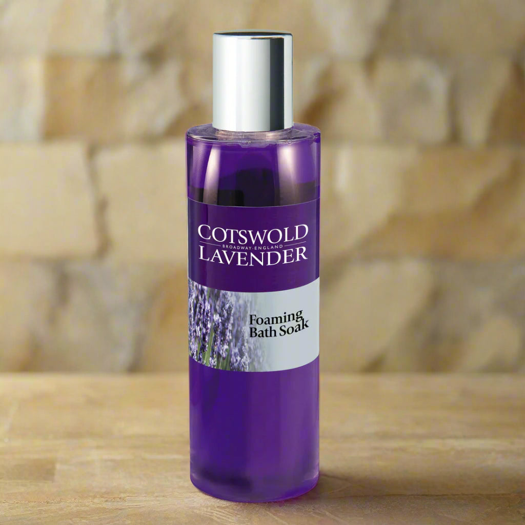 Purple bottle of Cotswold Lavender foaming bath soak on a white background