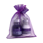 Cotswold Lavender bath and body products in a purple gift bag on a white background