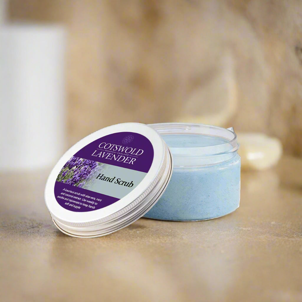 Coiswold Lavender hand scrub in a jar with a purple label on a white background